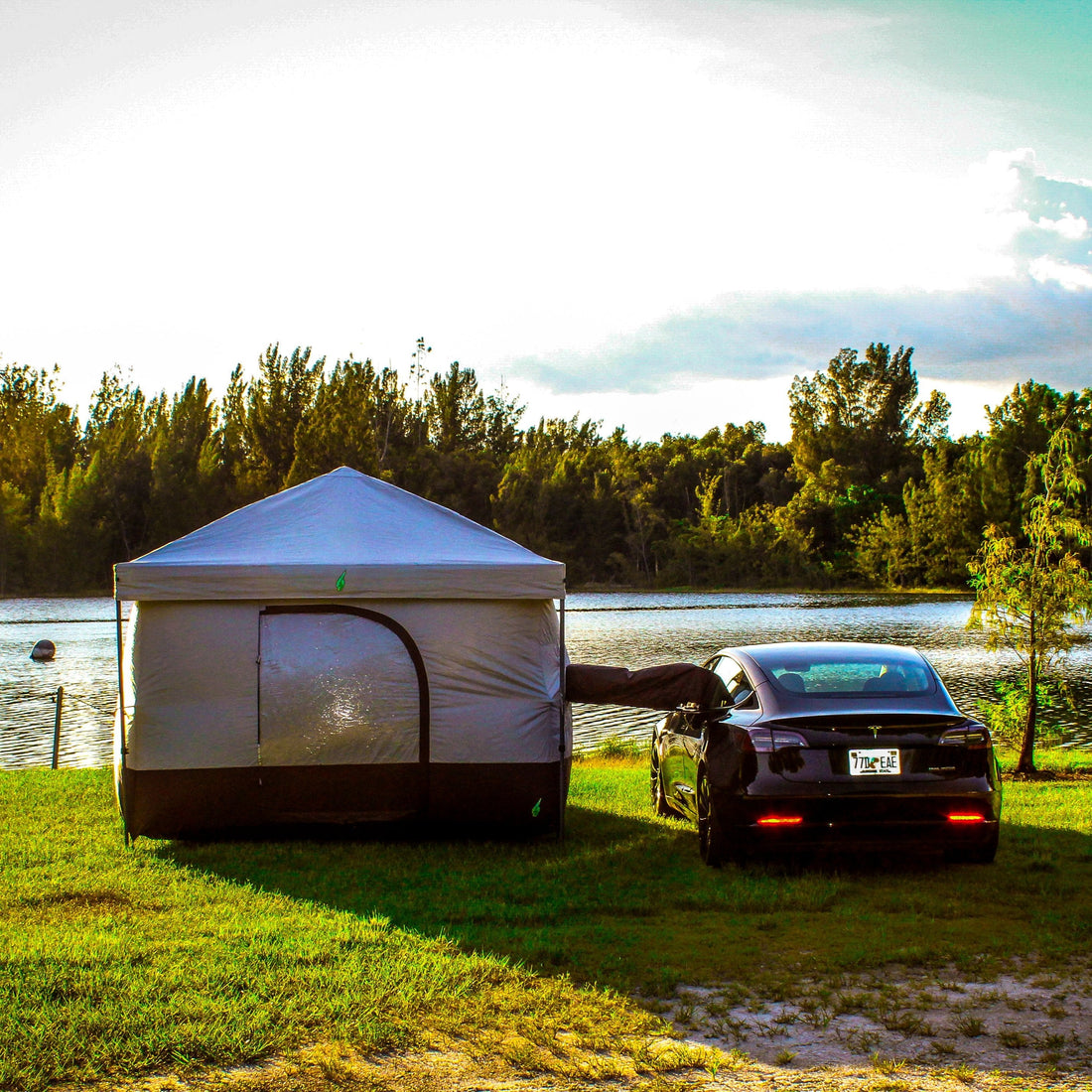 Car camping and glamping tent for Tesla Model Y, featuring an awning, power outlets, and inflatable options.